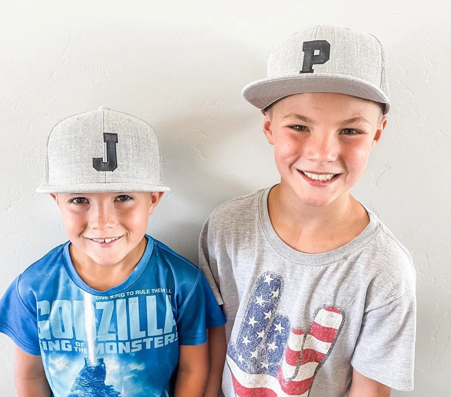 VARSITY INITIAL - Child Size - Flat Brimmed Hat - Camo w/ Black Letter